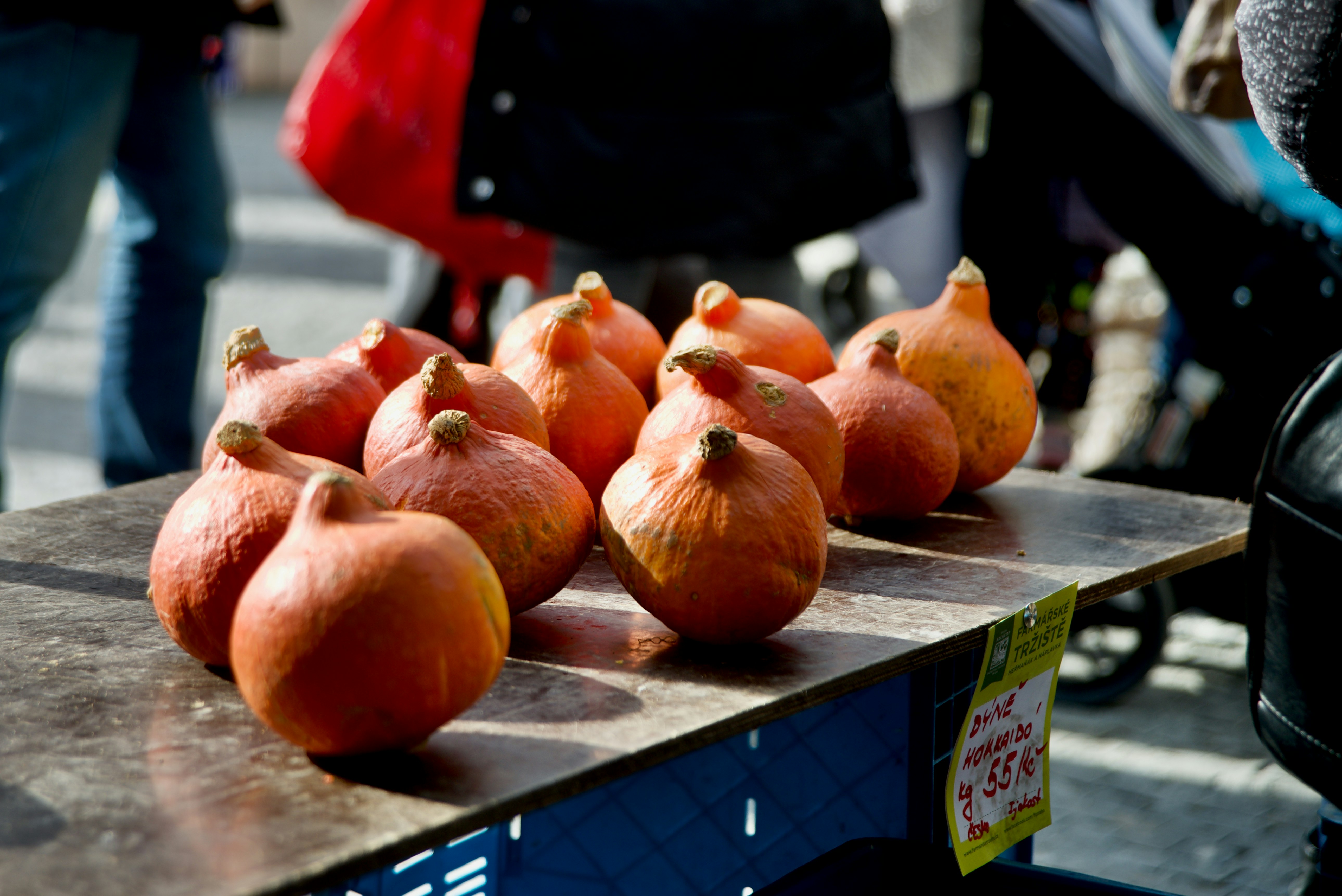 red and brown round fruits on gray wooden table